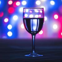 a glass of wine, bokeh background premium photo