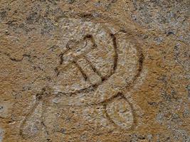 old communism symbol on a wall photo