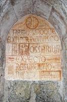 medieval latin inscription outside italian church photo