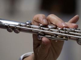 hands playing traverse flute photo