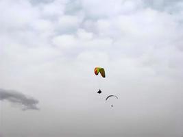 paraglider on cloudy sky photo