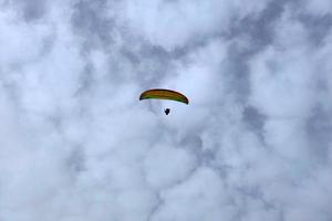 paraglider on cloudy sky photo