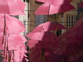 Grasse France pink umbrellas street photo