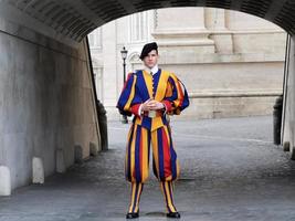 ROME, ITALY - JUNE 16 2019 - Swiss guard in Saint Peter Church in Vatican photo