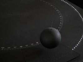 Foucault pendulum ball moving detail photo