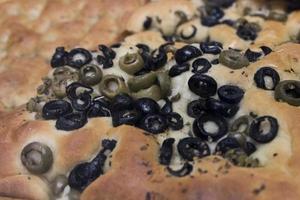 liguria focaccia with black and green olives photo