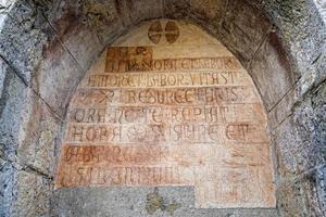 medieval latin inscription outside italian church photo