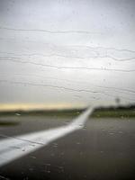 rain drops on airplane window photo