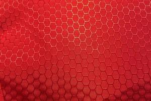 Fondo de patrón de tela sintética roja hexagonal foto