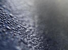 dew water drops on blue metallic surface photo