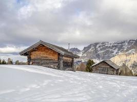 dolomites snow panorama wooden hut val badia armentarola photo