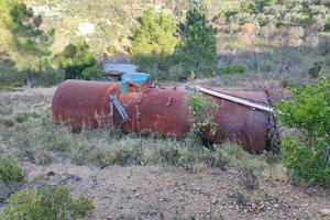 Old abandoned rusted water tank photo