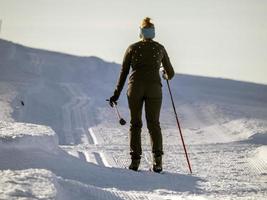 cross country nordic skiing in dolomites photo