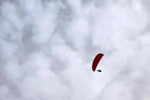 paraglider on cloudy sky photo