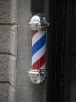 barber shop sign red white and blue photo