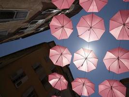 Grasse France pink umbrellas street photo