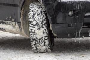 winter snow tire of car detail photo