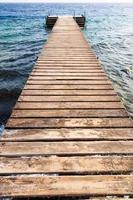 wooden pier on Coral beach of Red Sea in Aqaba photo