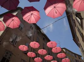 Grasse France pink umbrellas street photo