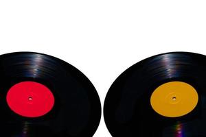 Two 33 rpm vinyl records on white backgrounds photo