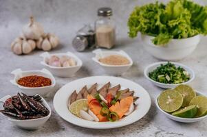 Grilled Liver Slices with, carrots, chili, spring onions, and mint. photo