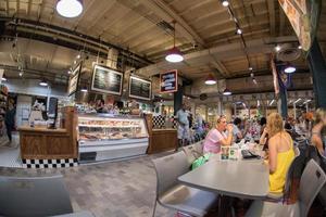 PHILADELPHIA, USA - JUNE 19, 2016 - People buying and eating at city market photo