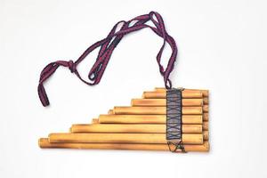 Pan flute on a white background photo