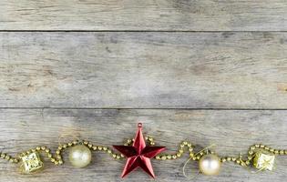 Christmas decorations on old wooden background. photo