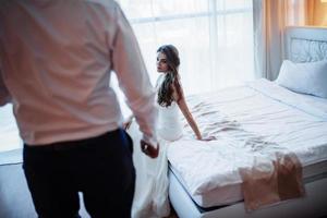 bride in hotel room photo