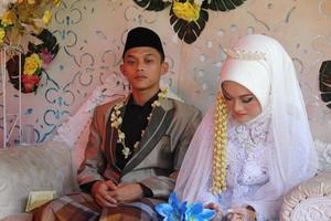 Cianjur Regency West Java Indonesia on June 12, 2021 - A happy couple.  Indonesian Muslim Wedding. photo