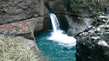 beutiful waterfall with torquose water photo