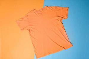 T-shirt mockup on colorful background. Flat lay tee template photo