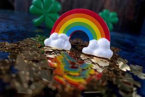 Saint Patricks Day gold shamrocks reflecting colorful rainbow photo