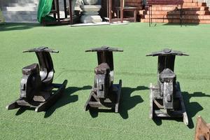 Wooden benches in motorbike shape for traveller at the temple, thailand. photo