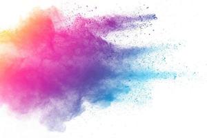 abstract multicolored powder splatted on white background,Freeze motion of color powder exploding photo