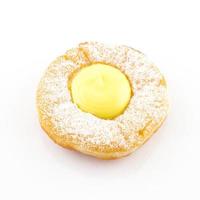 Close up of cream donut isolated on white photo