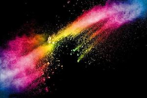 Multicolored powder explosion on black background. photo