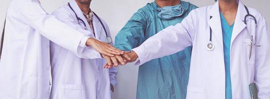 Doctors and Nurses coordinate hands. Concept Teamwork photo