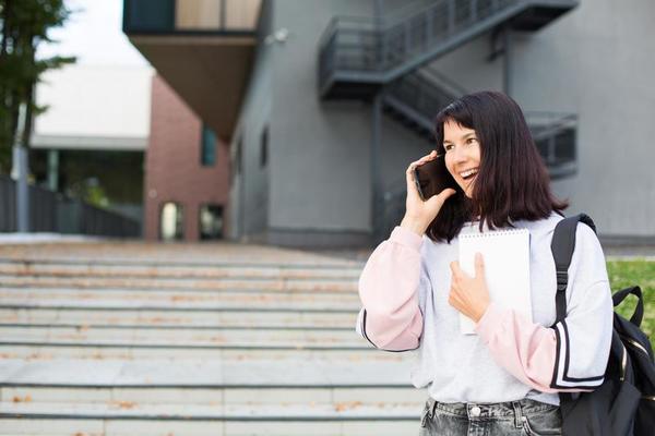 Student On Phone Stock Photos, Images and Backgrounds for Free Download