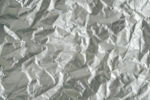Crumpled foil as a background texture. Copy, empty space for text photo