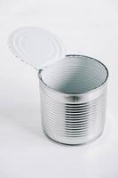 Empty open tin can on a white background photo
