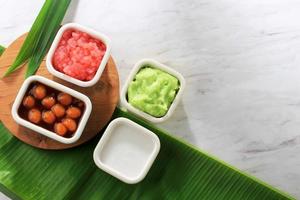 Bubur Campur Madura or Maduranese Mix Porridge, with Various Ingredient. Popular in Indonesia during Fasting or Lebaran for Takjil Breakfasting. photo