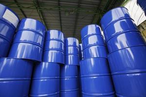 Oil barrels blue or chemical drums vertical stacked up photo