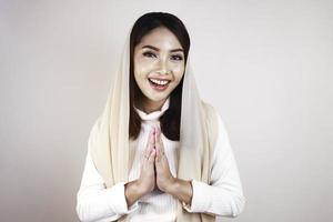 Portrait young beautiful Muslim woman wearing a hijab. Eid Mubarak greeting photo