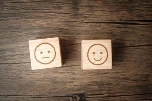 emotion face symbol on wooden blocks. mood, Service rating, ranking, customer review, satisfaction, evaluation and feedback concept photo