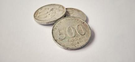 Two side of old 500 rupiah coin from Bank Indonesia with a grey background. Made of year is 2016. Indonesian rupiah, 500 Rupiah, Indonesian currency, Indonesian money background. photo