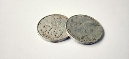 Two side of old 500 rupiah coin from Bank Indonesia with a grey background. Made of year is 2016. Indonesian rupiah, 500 Rupiah, Indonesian currency, Indonesian money background. photo