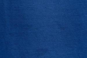 Dark Blue denim fabric texture background, the strong cotton cloth used especially to make jeans. photo