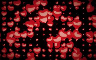 patrón sin costuras del día de san valentín con corazones rojos 3d sobre un fondo negro foto