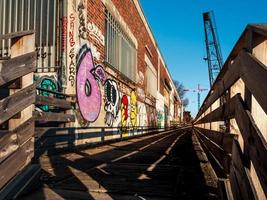 Old port, abandoned buildings, bridges, graffiti on the walls of houses in Strasbourg photo